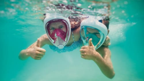 Two kids snorkeling in St. Joseph Bay